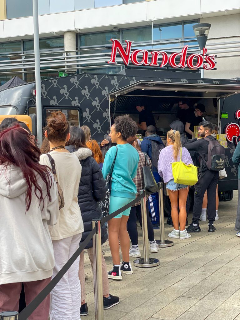 queue outside food truck at nandos student event