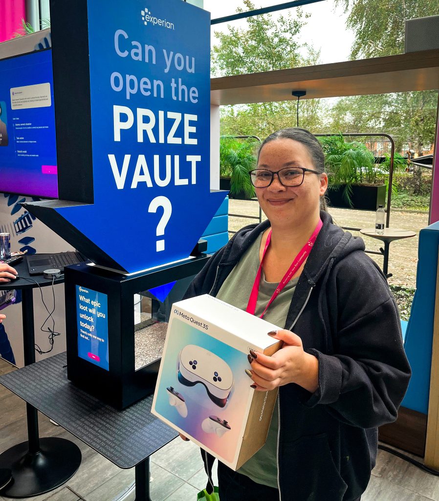 Experian Branded Prize Vault with Lady stood in front showing her prize