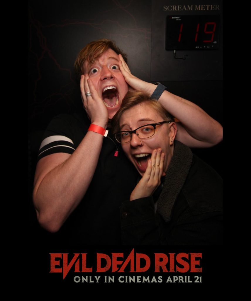 couple stood screaming in scream booth for evil dead rise film premier