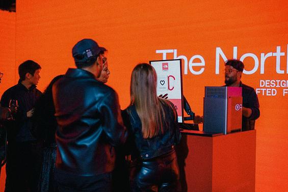 Event guests designing engraved north face mug