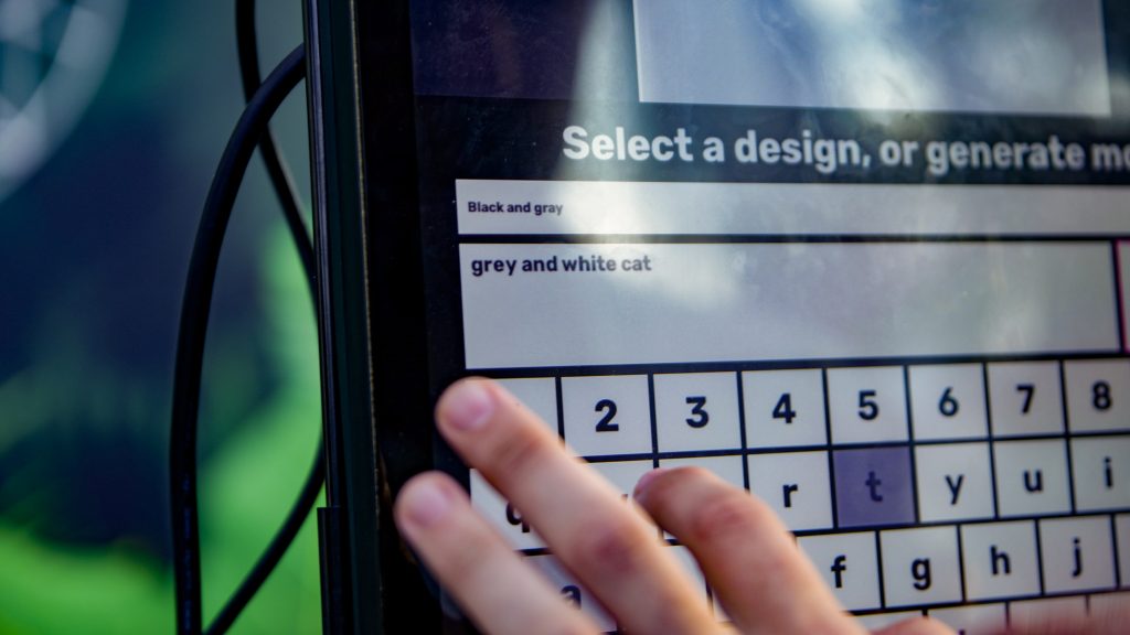man designing merchandise on merch lab merchandise personalisation software