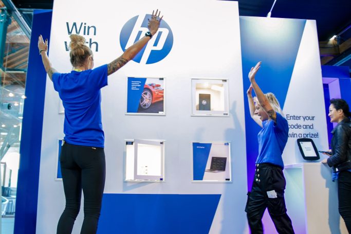 Guest celebrating a win at our interactive Prize Wall at the AI Summit.