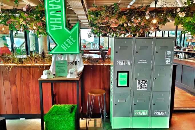 A prize locker at the Pravha Summer Tour with a large illuminated arrow pointing toward the locker