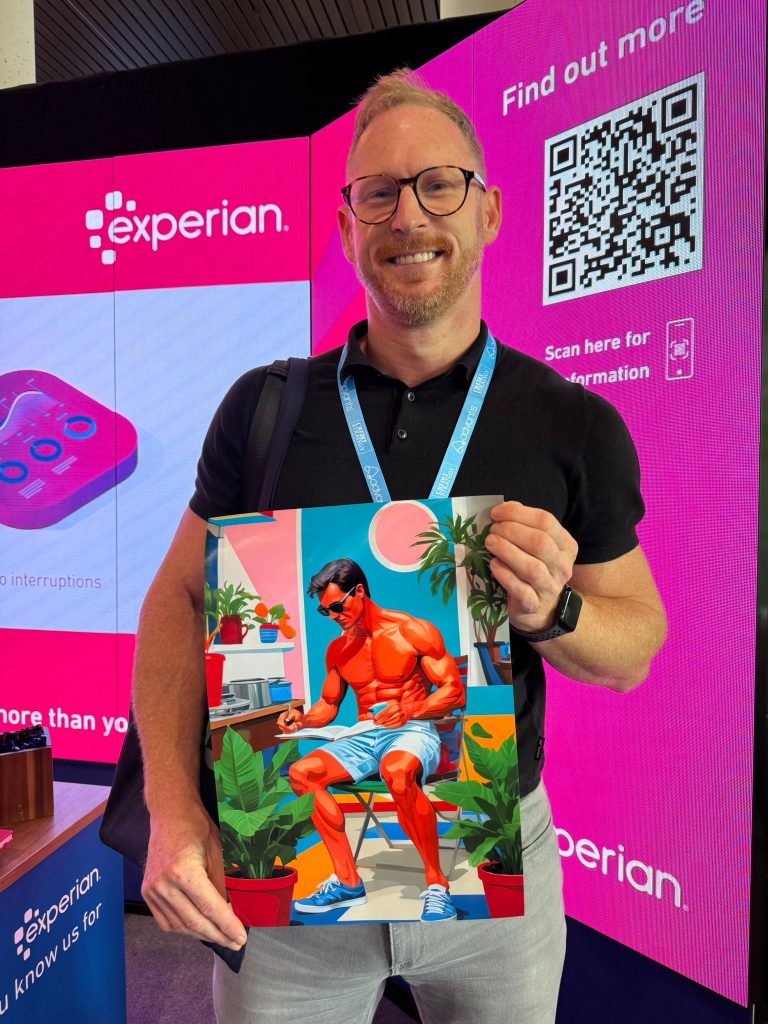man holding his AI artwork at Experian brand event