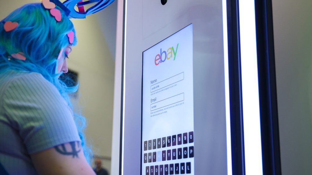 Lady inputting data into AI Photo Booth