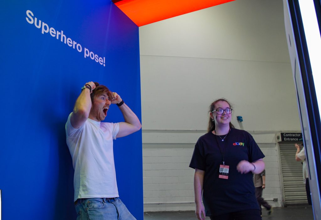 Comic con guest posing for a picture for their AI Trading Card