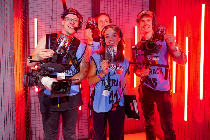 People in a custom branded photo booth at Goodwood Festival of Speed
