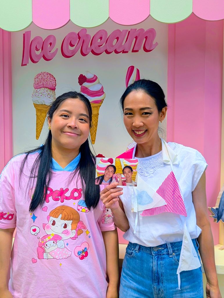 two happy event guests with their printed photo