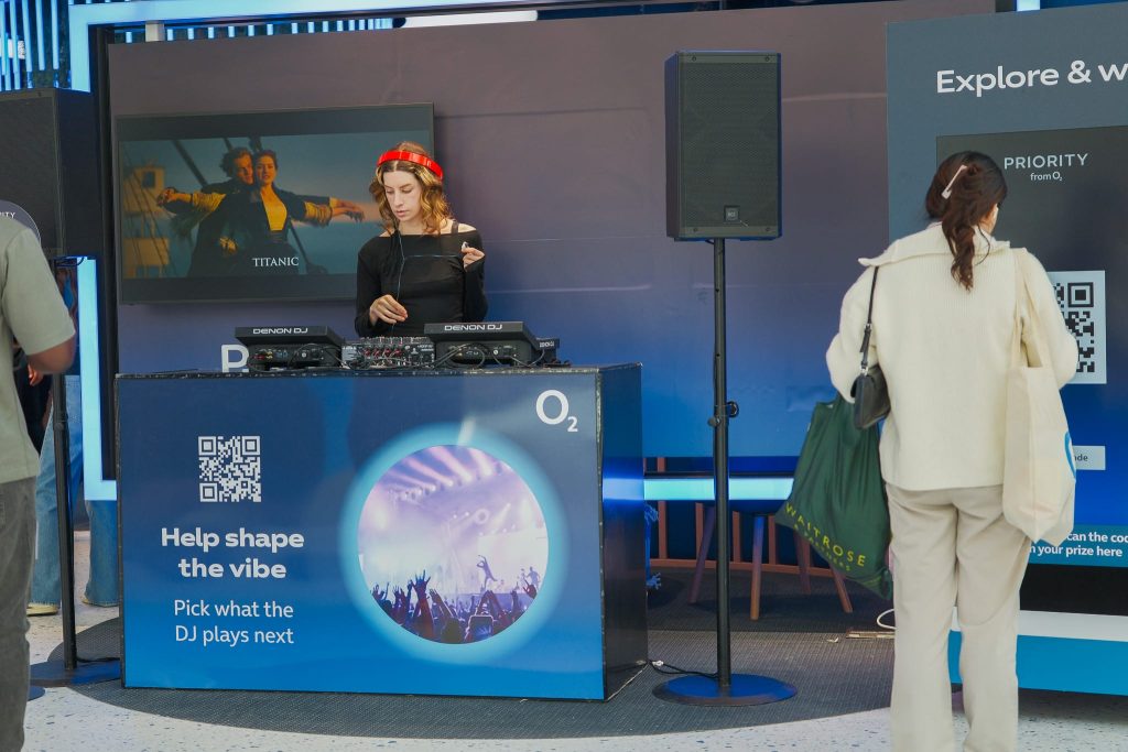 Vending Machine situated next to DJ at O2 store opening event