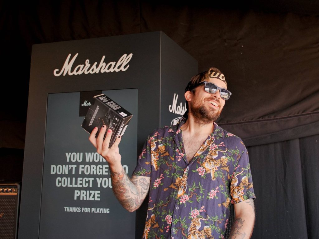 man with marshall speaker prize at 2000 trees festival