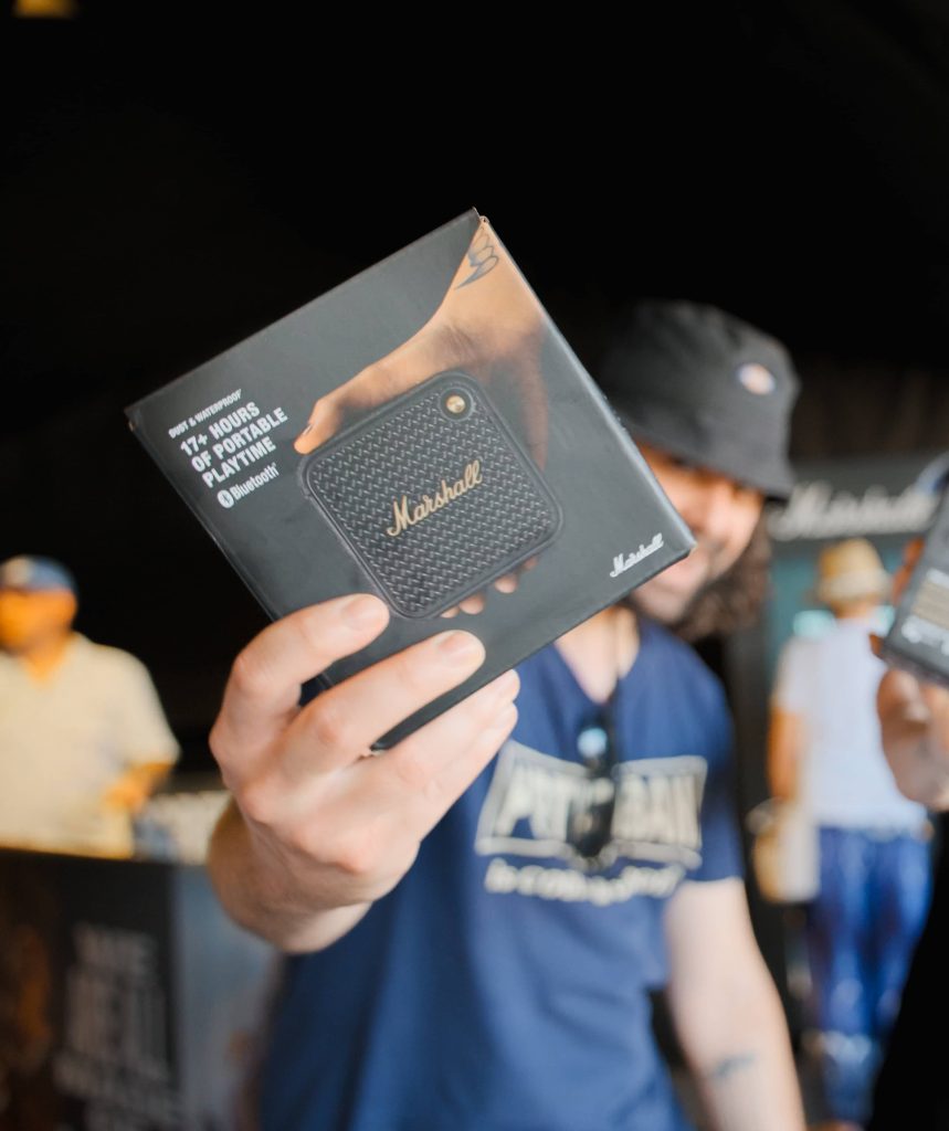 Man showing off marshall branded prize