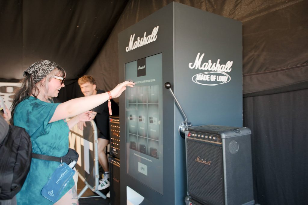 happy winner at festival vending machine