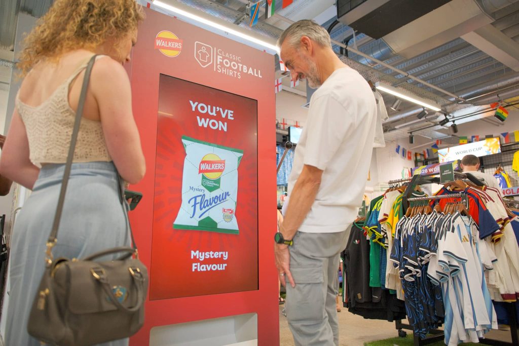 Man smiling at walkers smart vending machine
