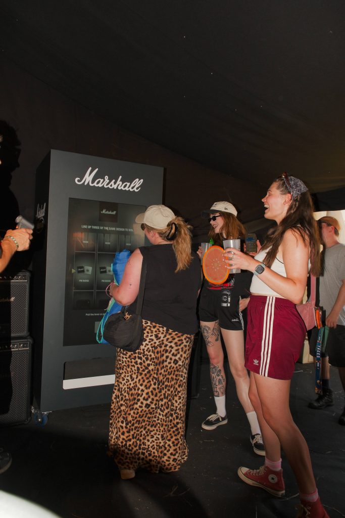 people laughing at marshall branded vending machine