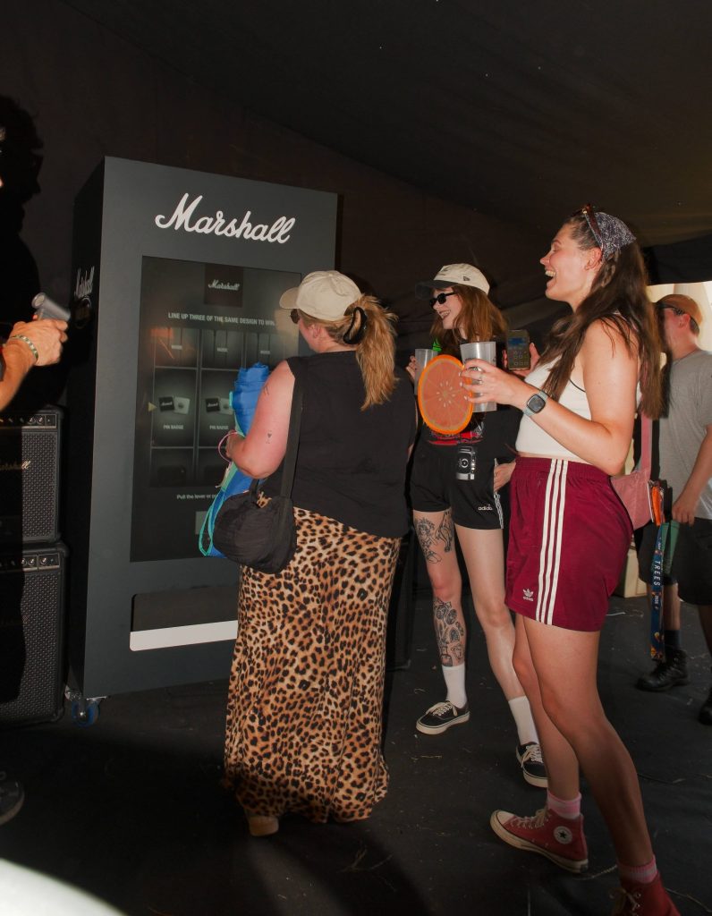 people laughing at marshall branded vending machine