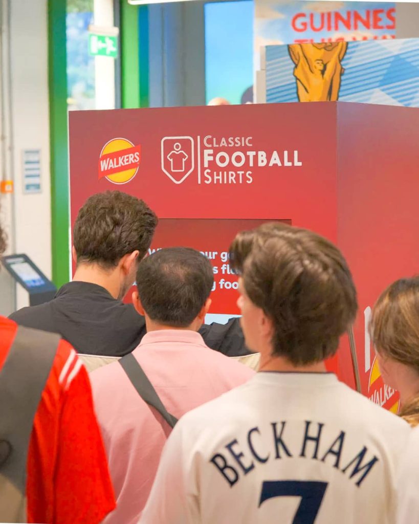 People queuing to use the walkers branded vending machine